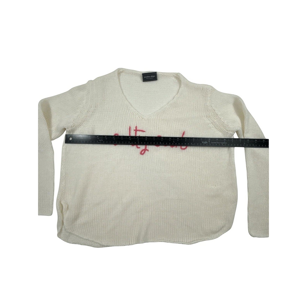 Bougiere Boutique cream cotton-acrylic blend V-neck sweater with pink 'salty soul' embroidery and side slits.
